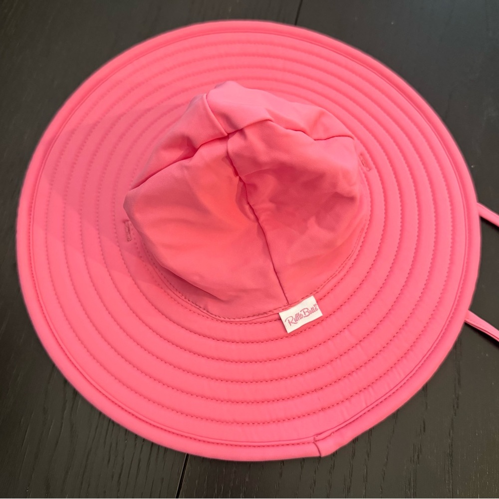 Ruffle Butts Rose swim hat in size 0-12 months
